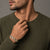 Man in an olive knit wearing the Bandor Essence Link Bracelet in platinum and 18k gold